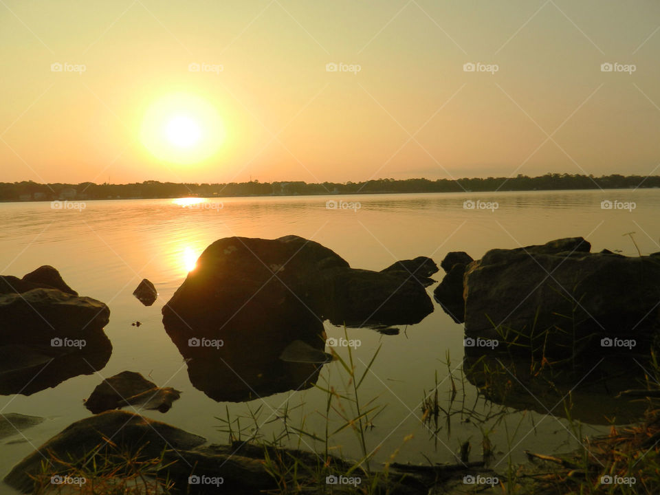 Sun reflecting on the lake at sunset