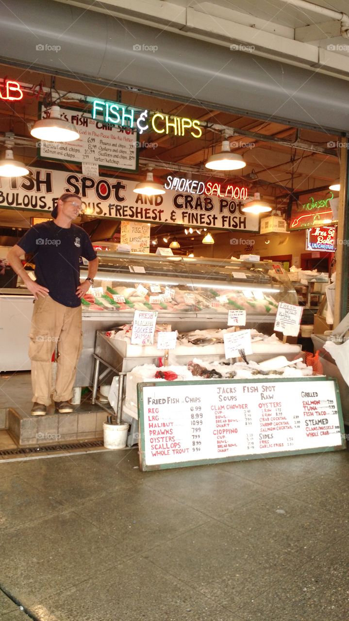 Pikes Public Fish Market. Guy selling fish
