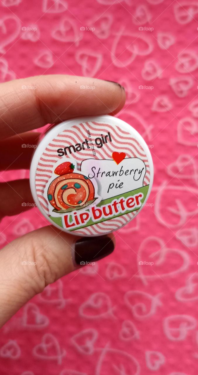 lip butter in the female hand beauty product