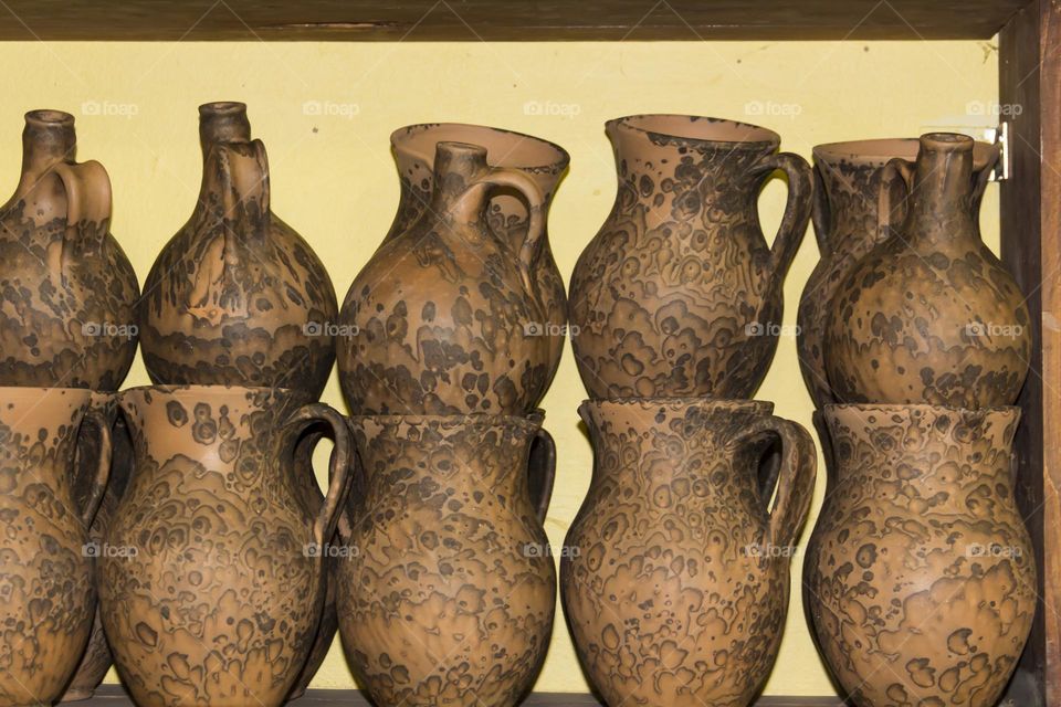 Clay pots in a potter's workshop.  Preservation of the culture and traditions of pottery.