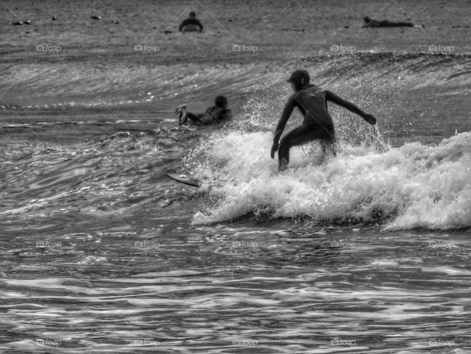 Surfers Getting In Position. California Surfing