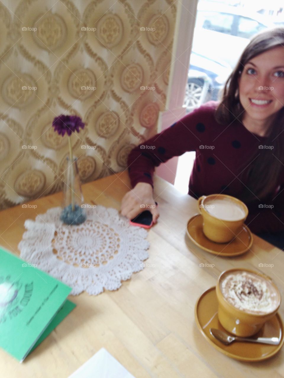 A woman eager to have her first sip of coffee.