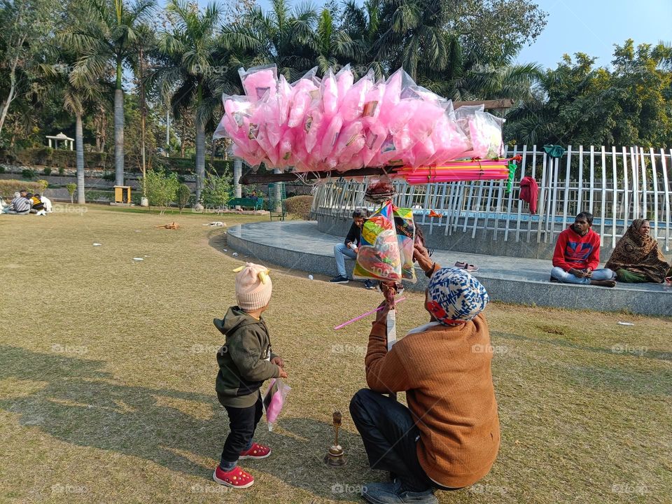 old type of cotton candy vendor in the park.