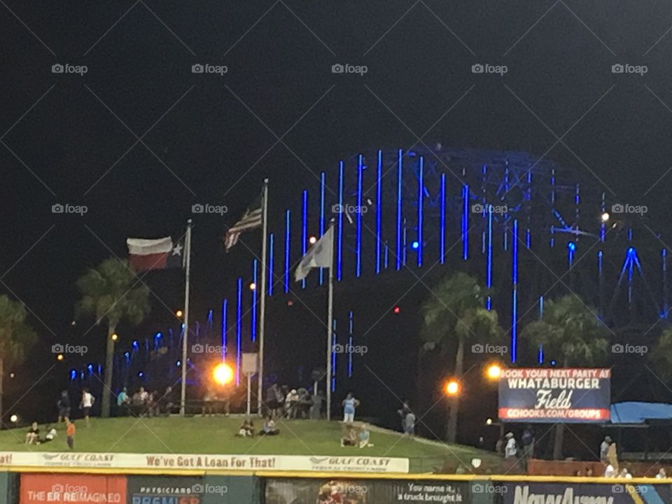 Corpus Christi bridge lit up with blue neon lights to honor police officers - Back the Blue. 