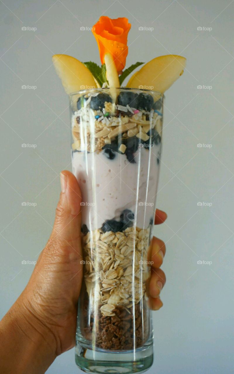 Fresh fruit smoothie - blueberry banana coconut strawberries and nuts