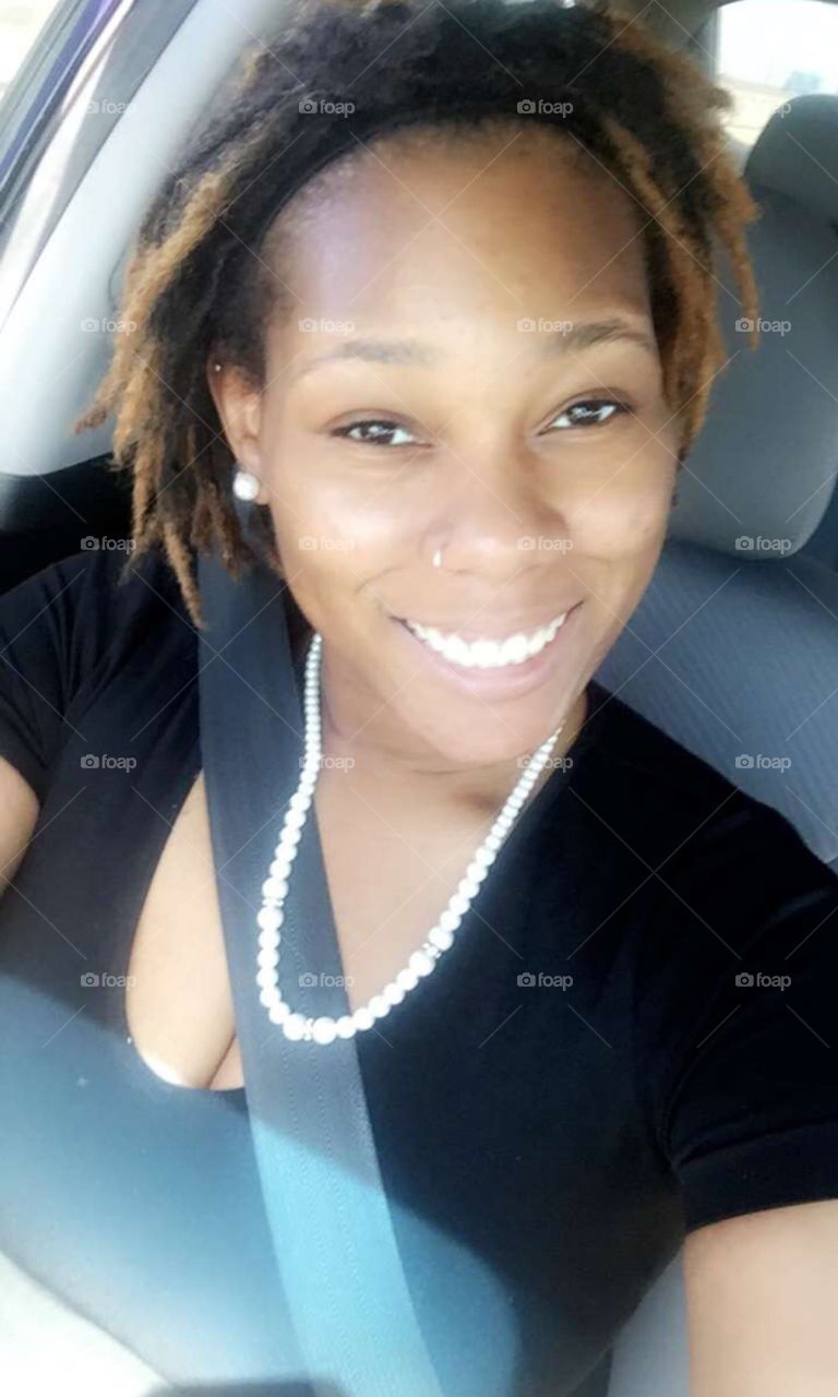All smiles this way. Gorgeous smile with some hanging Locs