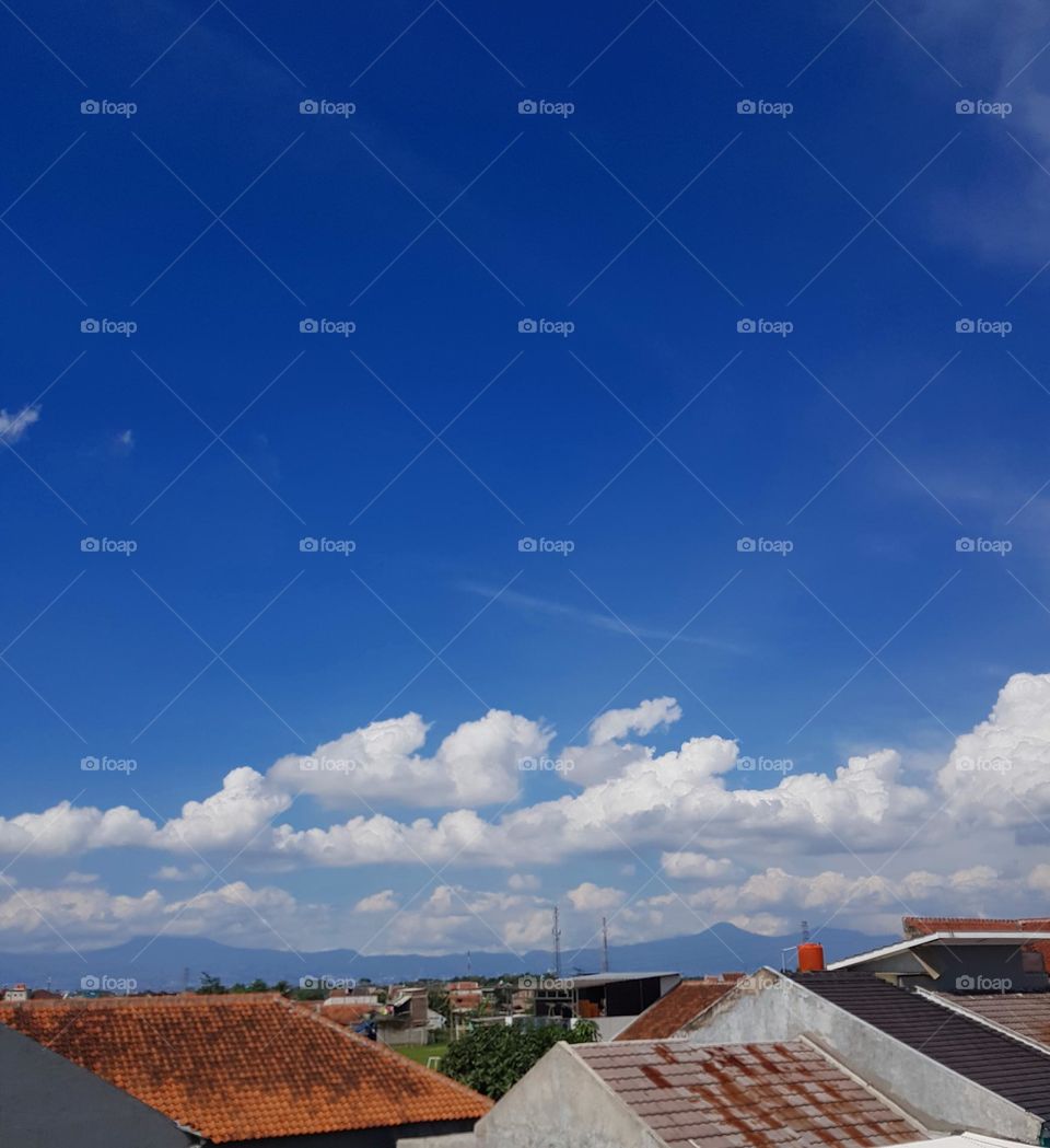 cloudy sky during the day .. clouds look white .. the sky refracts blue .. beautiful view