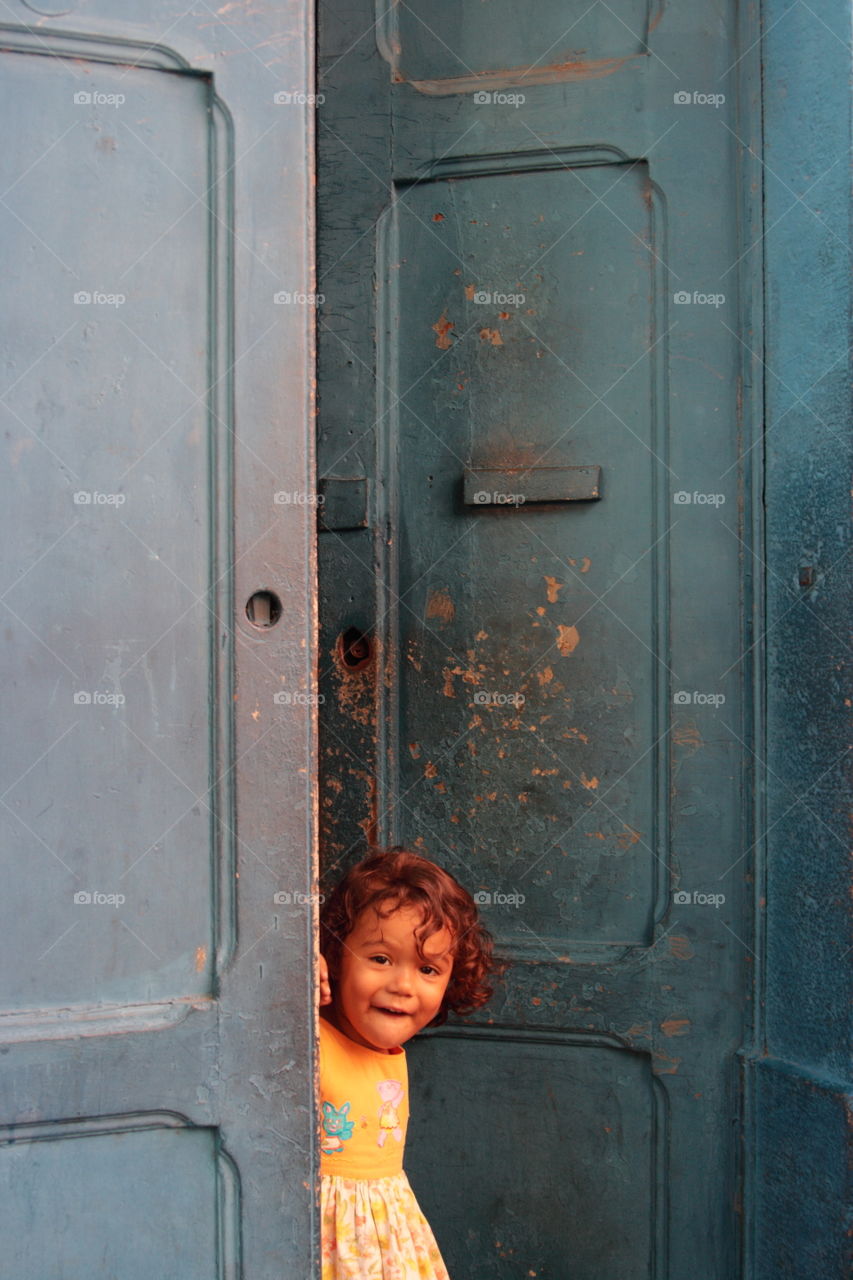 Little girl at the door in Rio de.