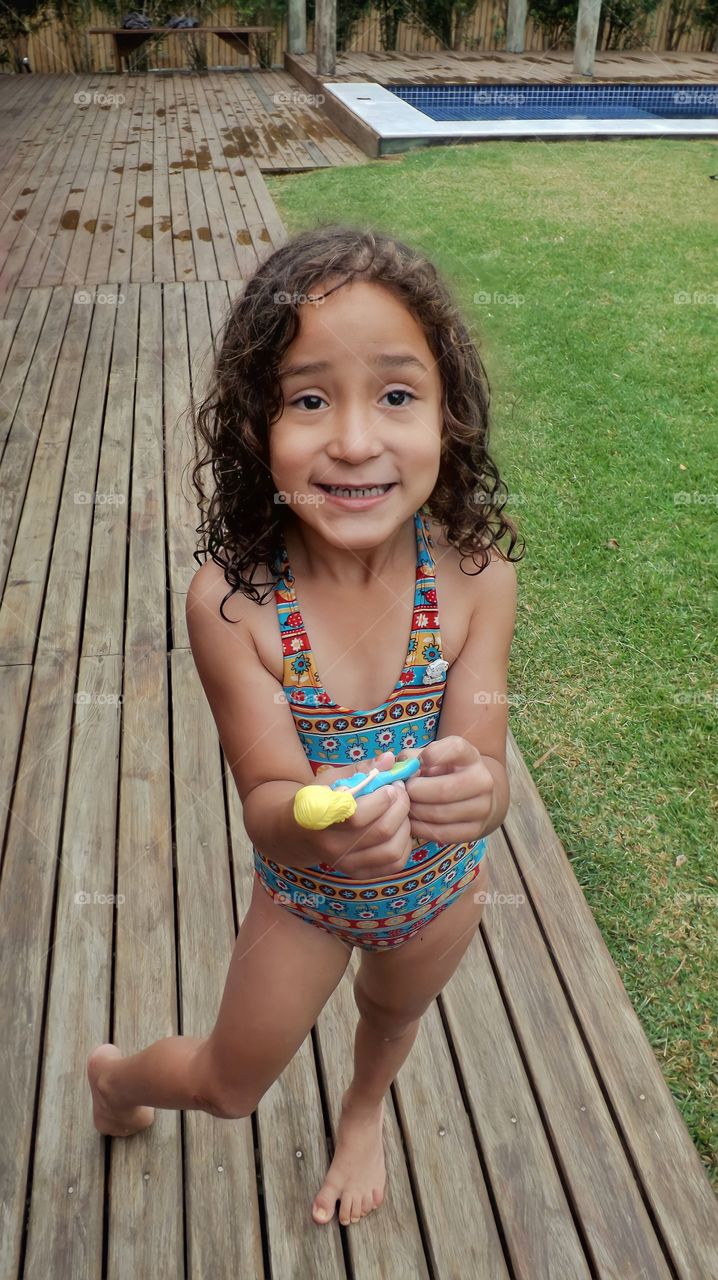 Girl smiling at the poolside