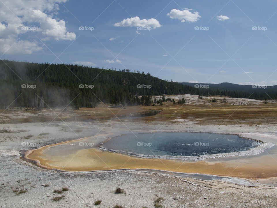 Beautiful, unique, and stunning geology on Geyser Hill in the magnificent Yellowstone National Park on a sunny summer day. 