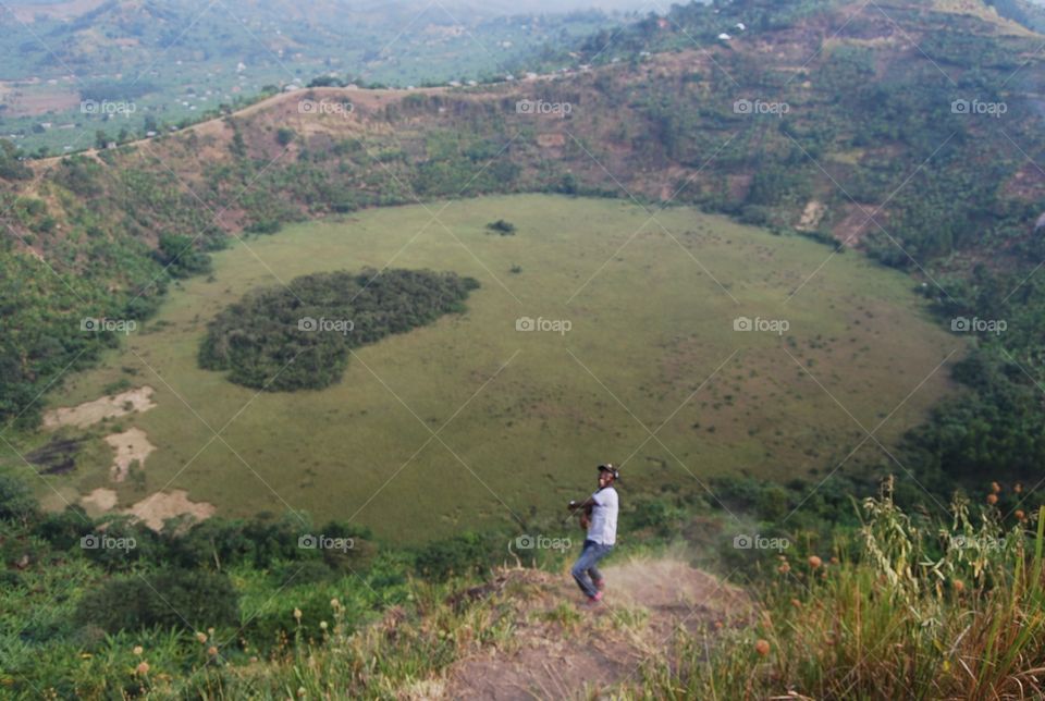Amazing beautiful Africa crater locally known as kyampyeyo ..the lake dried up and left a small forest in the middle of the swam crater that's in the shape of the map of Africa . this is found in rubirizi district in western uganda (village of lakes