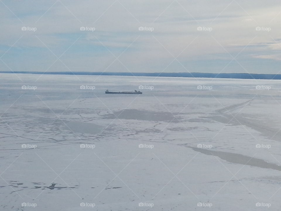 Freighter in the ice. a freighter in the ice in the Straits of Mackinaw 