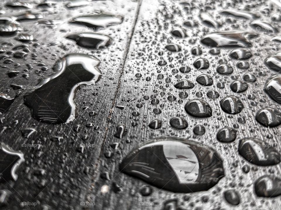 water droplets on wood in monochrome