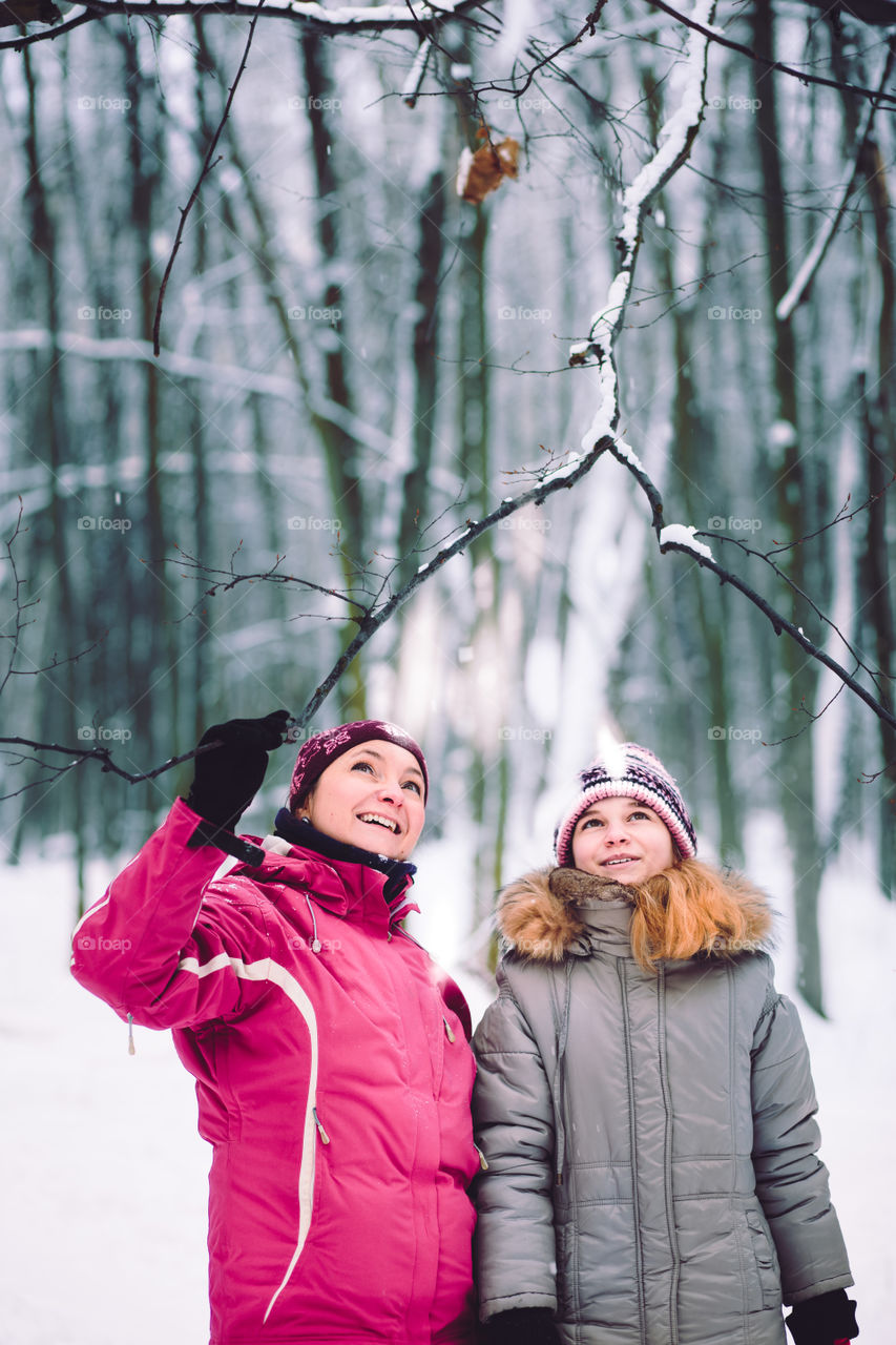 Winter with friends. Spending wintertime outdoors playing with snow
