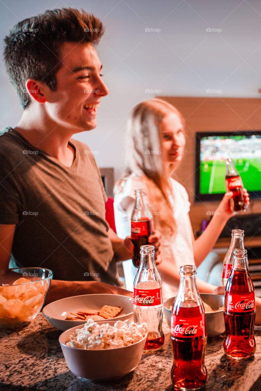 Enjoying the game with Coca-Cola