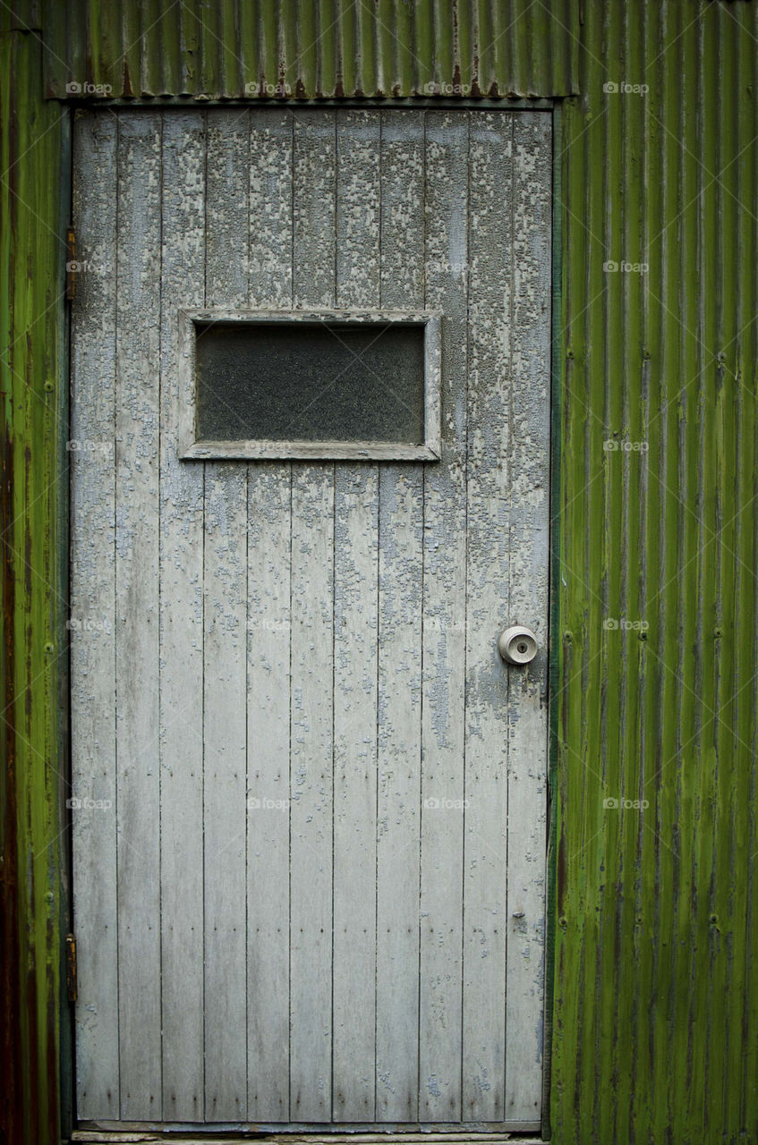 green wall iron window by hugo