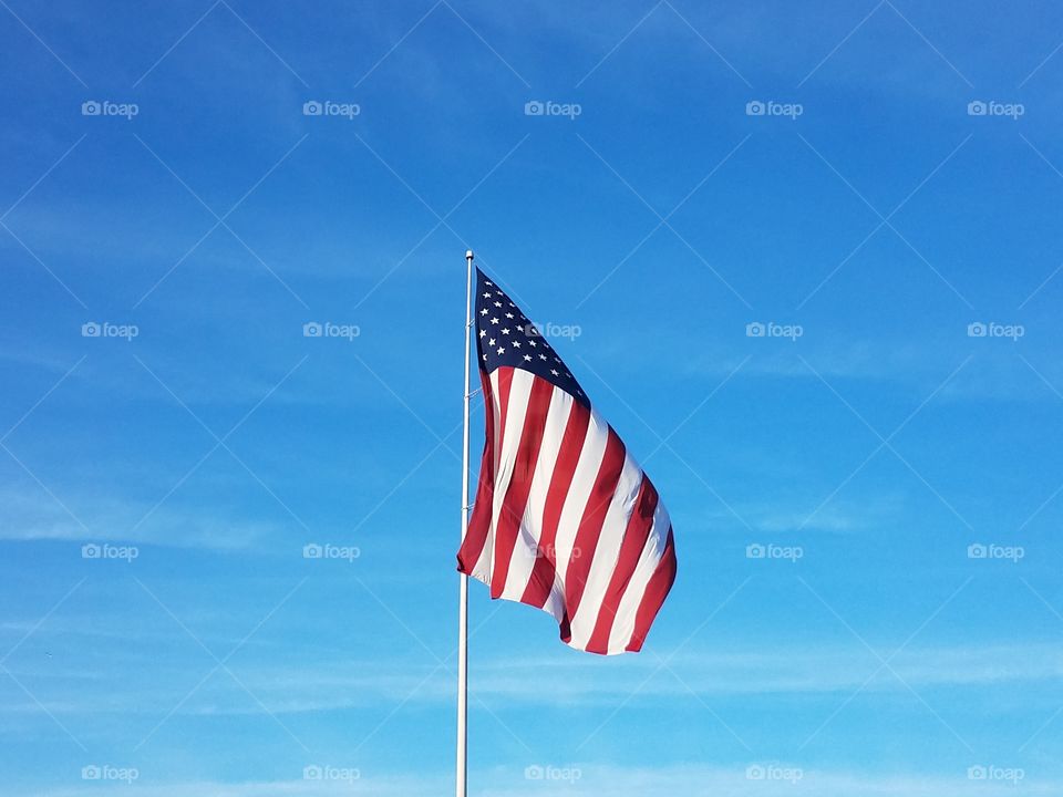 The American flag wavers in the wind