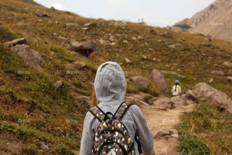 Children walk through the mountains