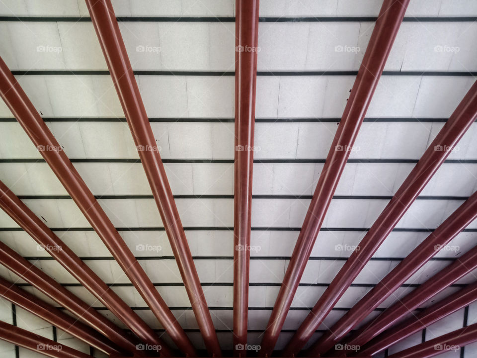 Full frame shot of modern symmetric architectural lines supporting a ceiling or roof