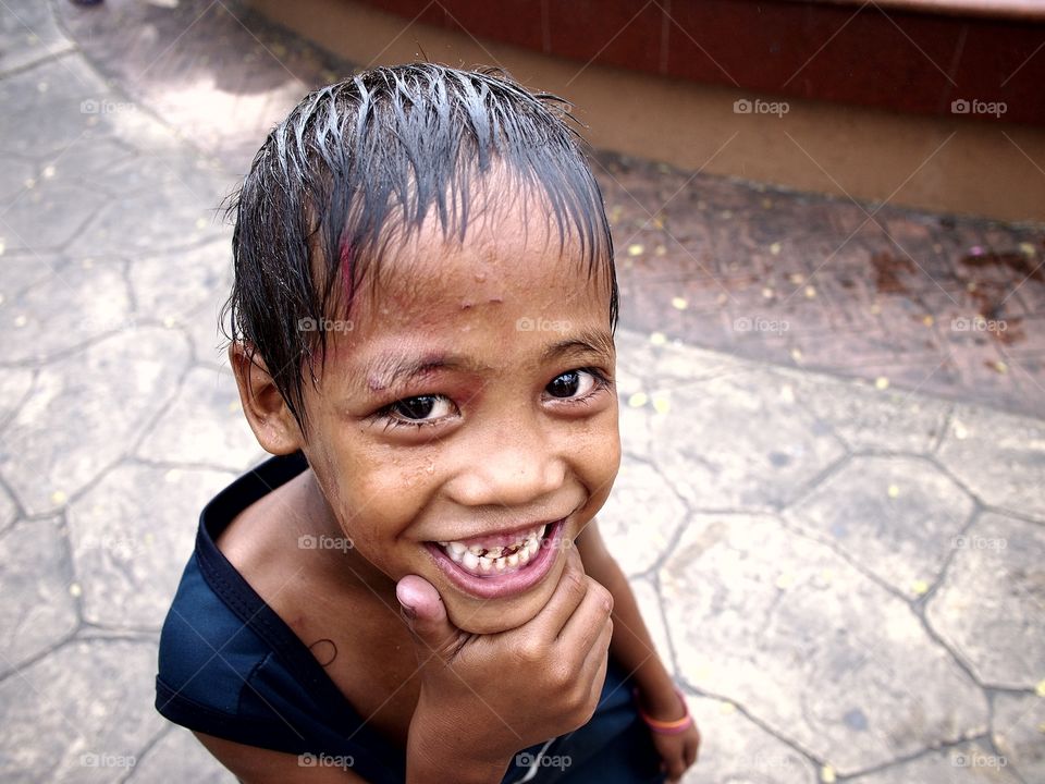 young asian kid smile for the camera