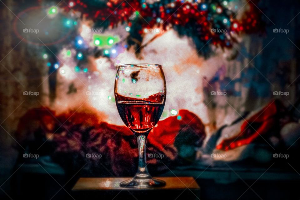 A glass of wine under the Christmas tree