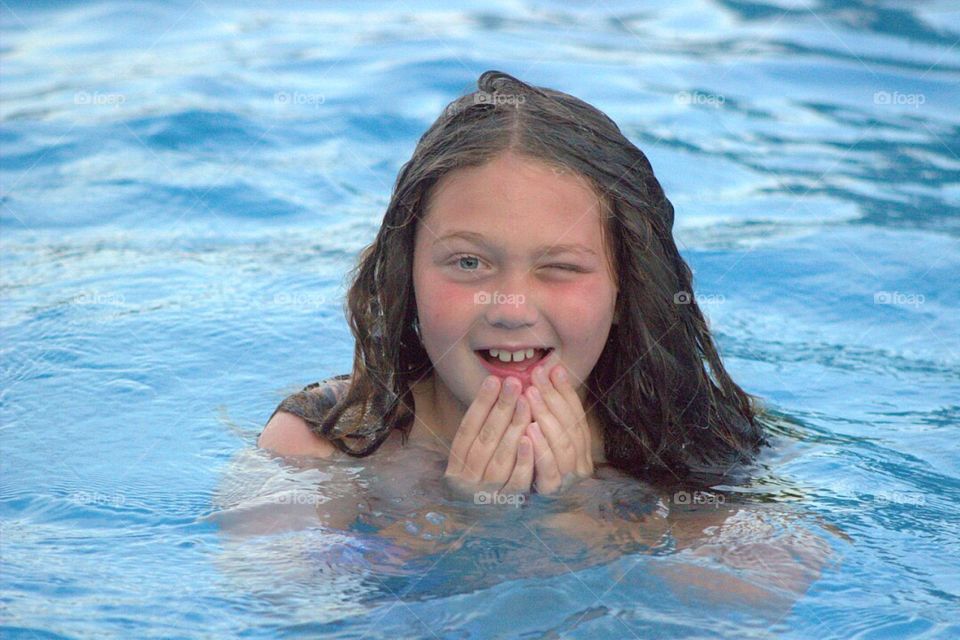 Girl enjoying in swimming pool