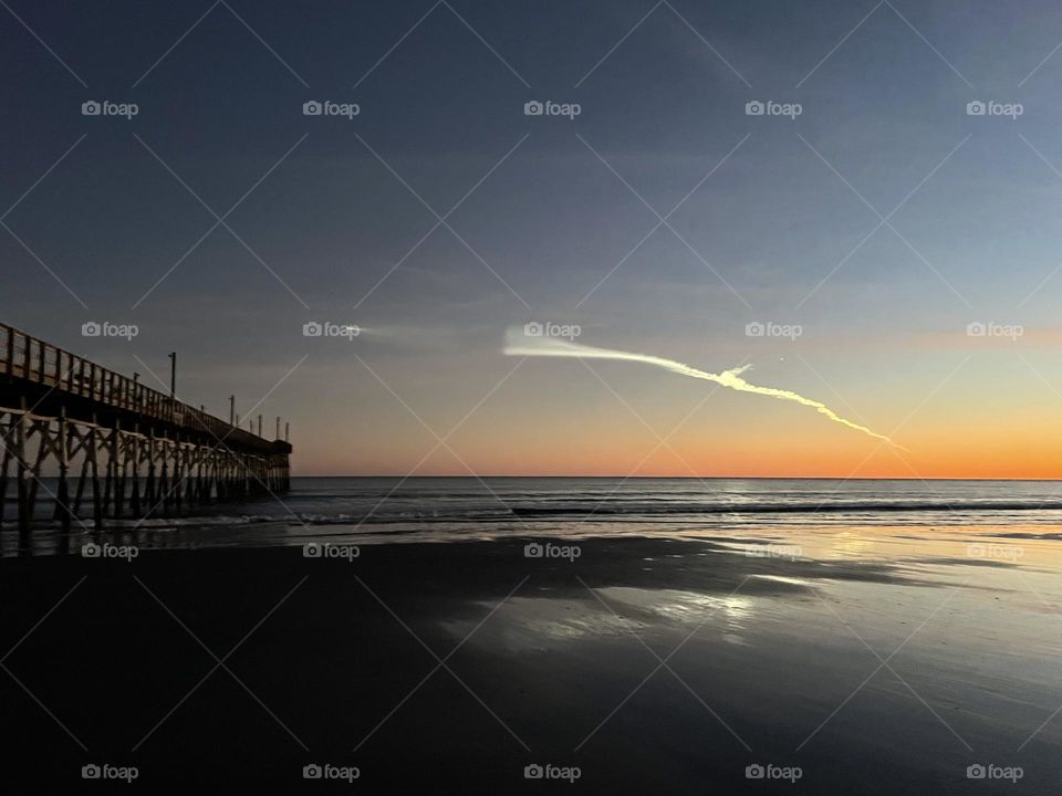 Rocket launch over pier