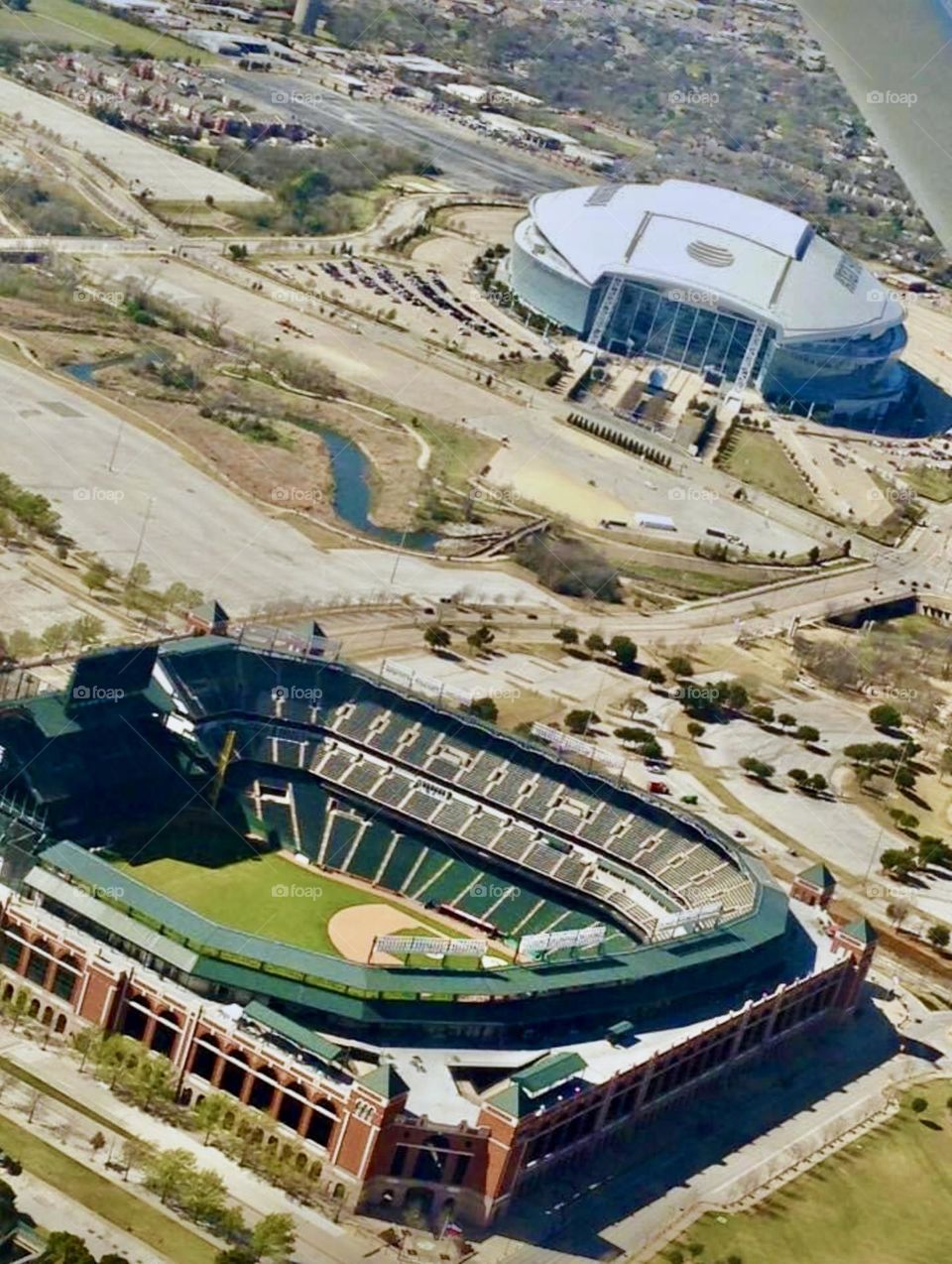 An aerial view of the Texas Ranger’s Major League Baseball Stadium and the Dallas Cowboys AT&T Stadium. 