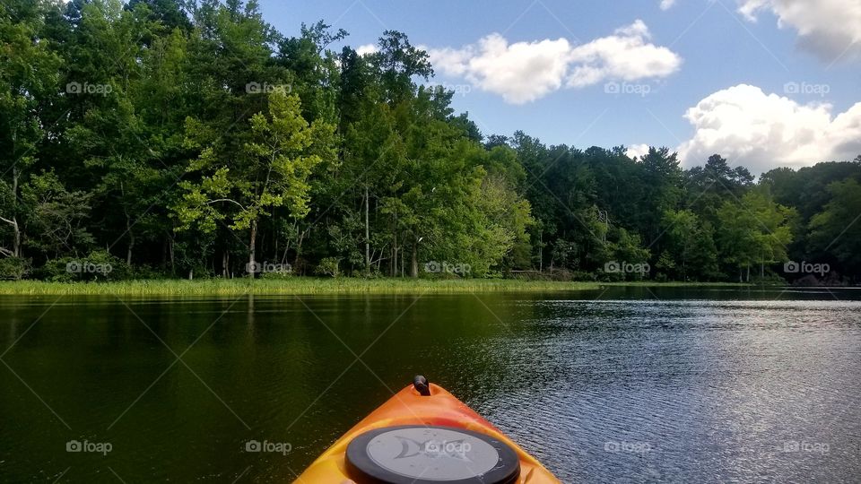 Out kayaking on the lake during a beautiful summer afternoon