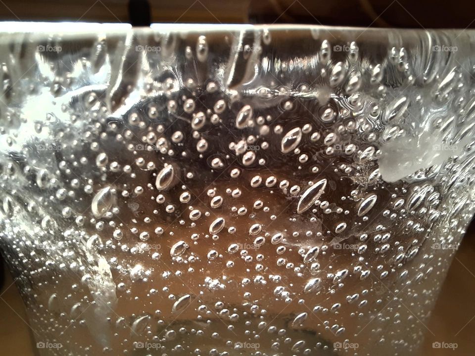 sunlit glass with air bubbles