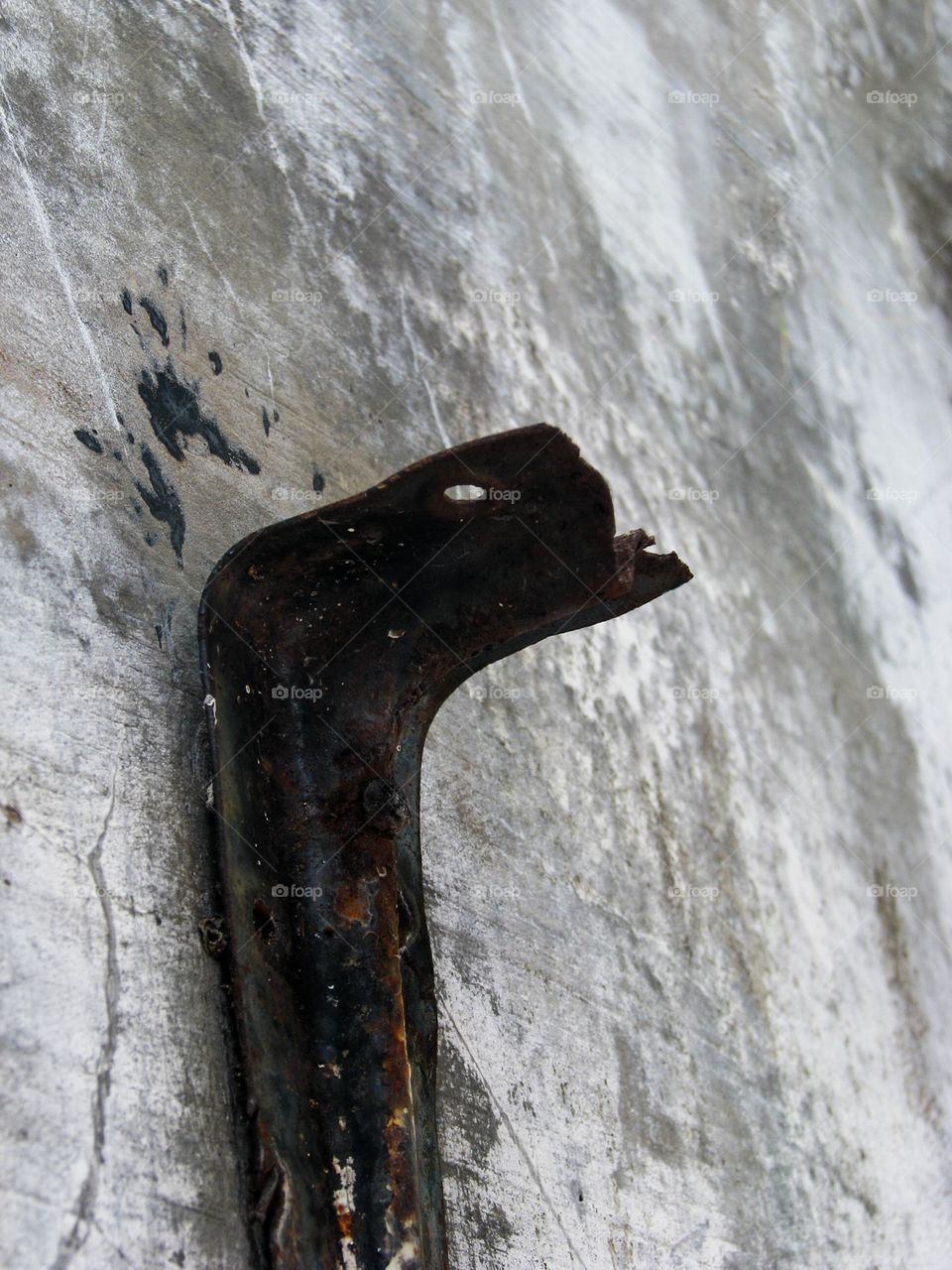 Close-up of old rusty metal pipe on the street in low angle view