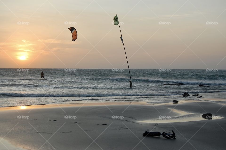 Kitesurfing in Jericoacoara beach with low tide at sunset. Brazil 