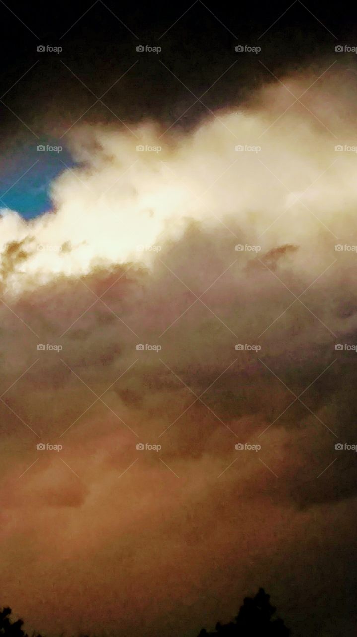 How Many of us get to See an Amazing Site a Spectacular Formation of Clouds and Colors with Sunset Light Background