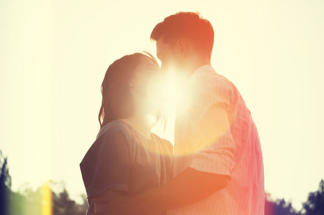 Spring kiss . Loving couple in the park 