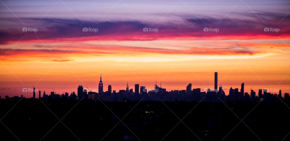 Silhouette of city and dramatic sky