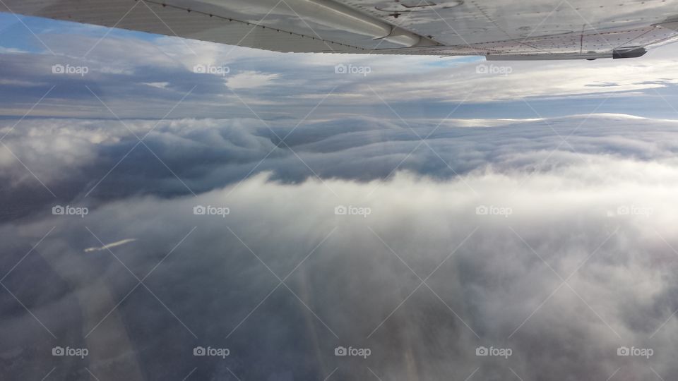 Cloud swells. Flying a light airplane over a cloud deck in northern New Mexico