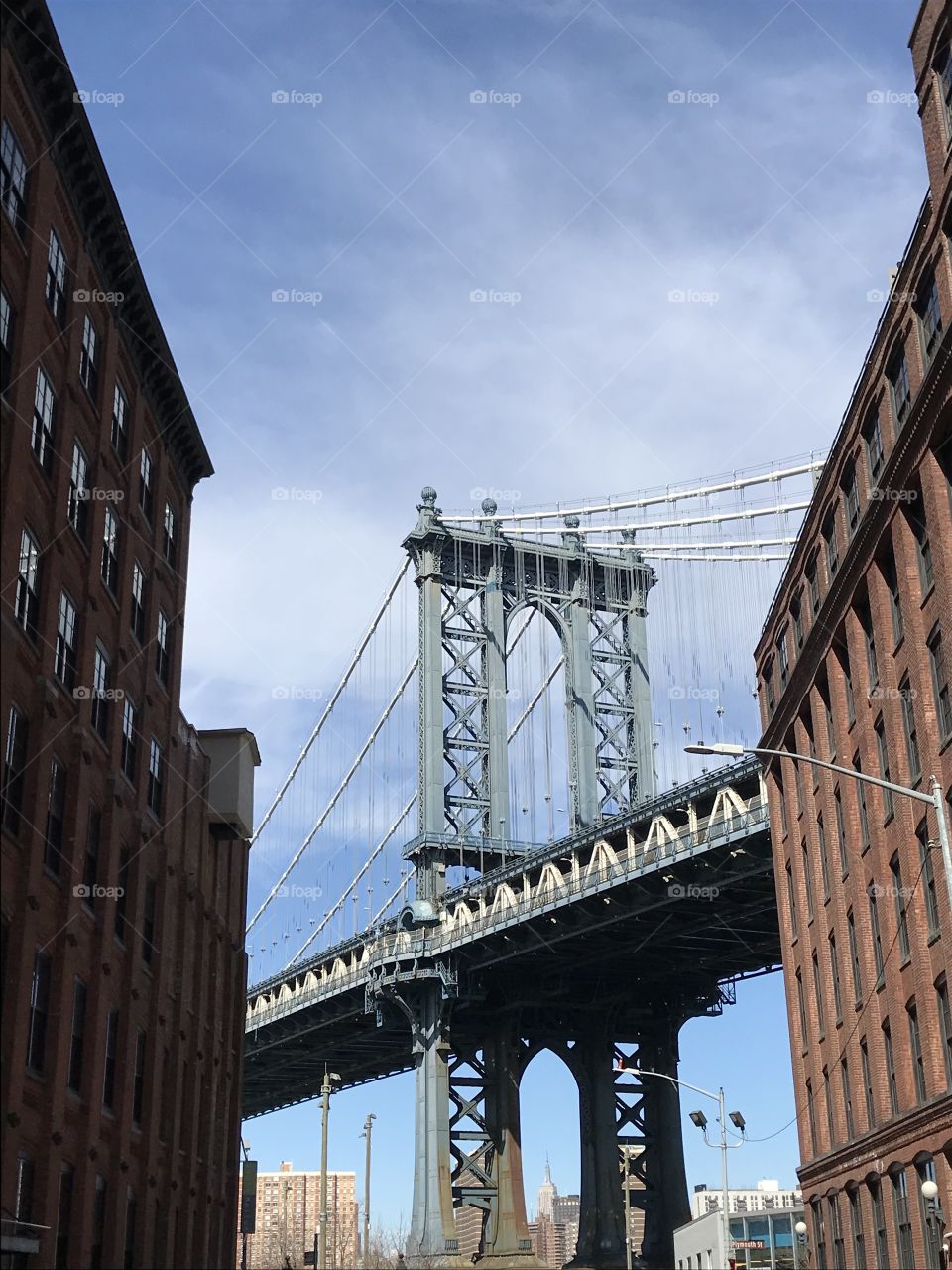 Brooklyn bridge in the middle of urban building 