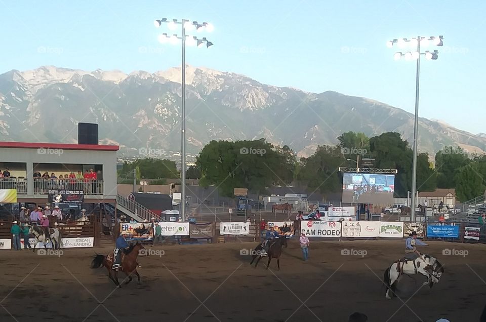 Rodeo with a buckin bronco. 4th if July