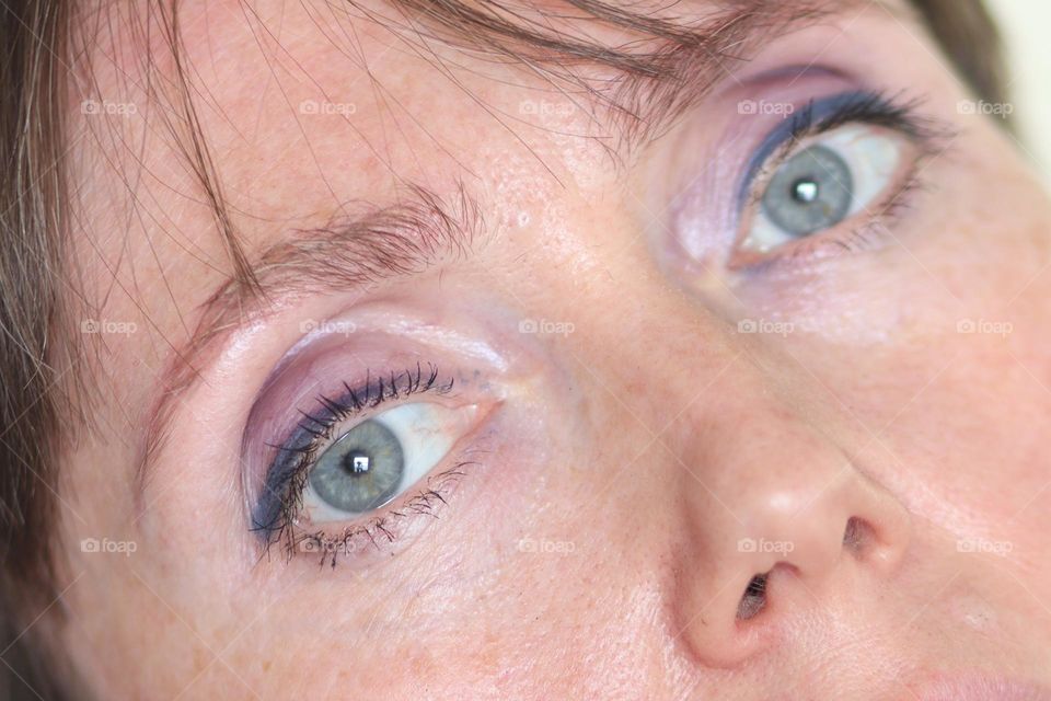 Middle-aged Caucasian woman with lilac eye shades