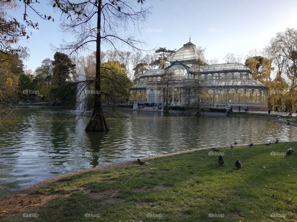 Crystal palace with pond landscape. Retiro park in Madrid, Spain