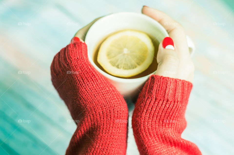 woman hand with cup of tea