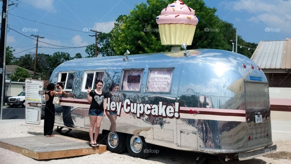 Woman standing near camper van