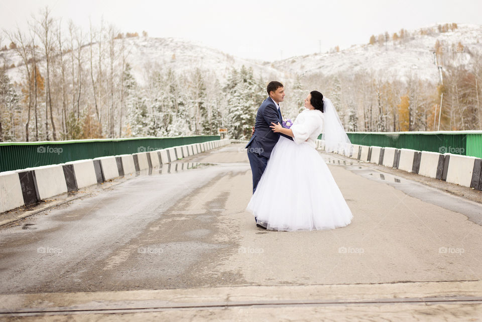 Side view of newly married couple