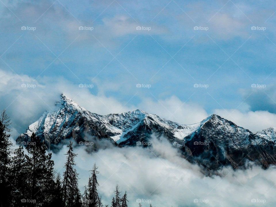 Clouds over the mountain peak