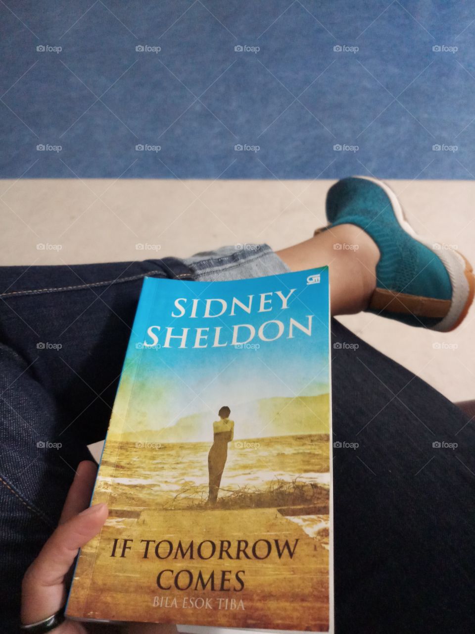 Reading book while waiting.