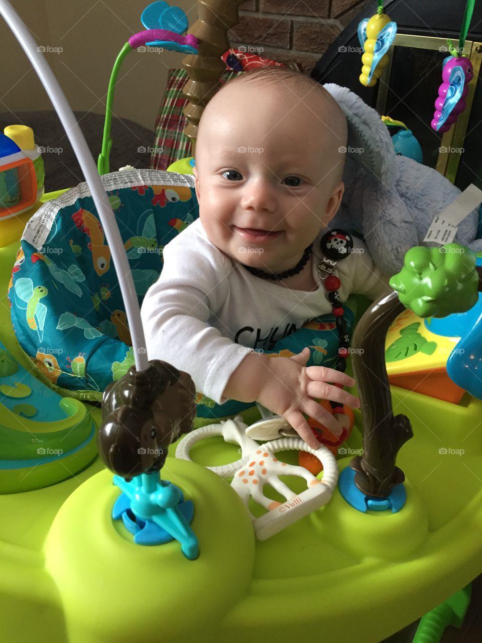 Loving his exersaucer on this sunny day, all smiles for his momma. 