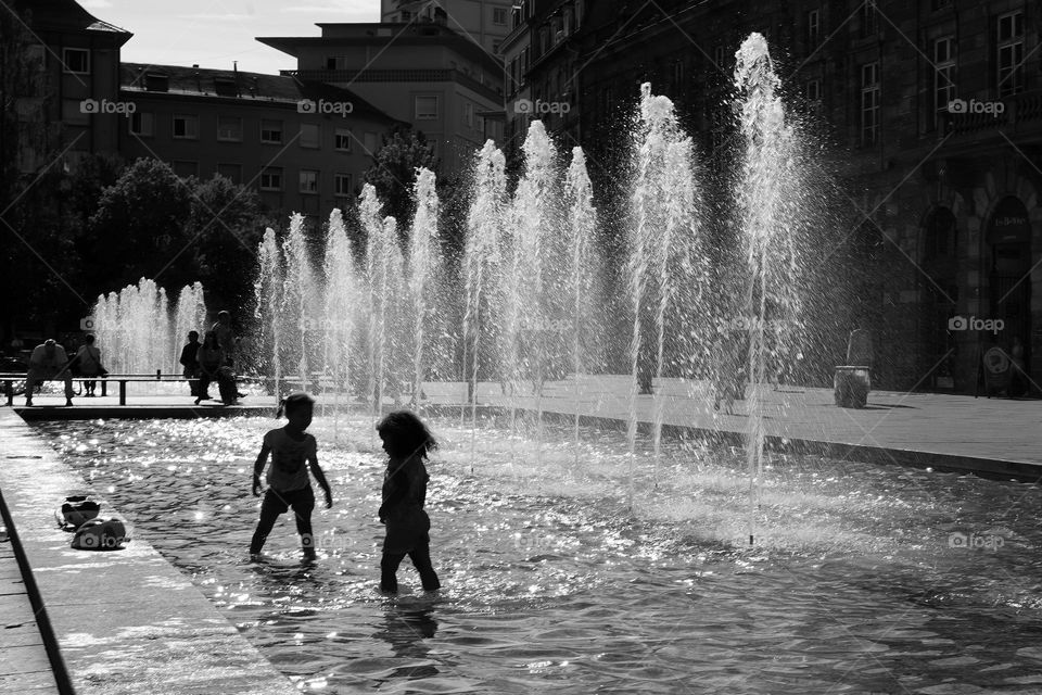 Children playing in the fountain