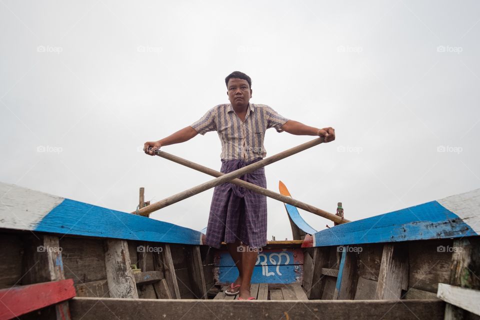 Colorful local life , A man with his boat at U bien , the longest wooden bridge in Mandalay Myanmar