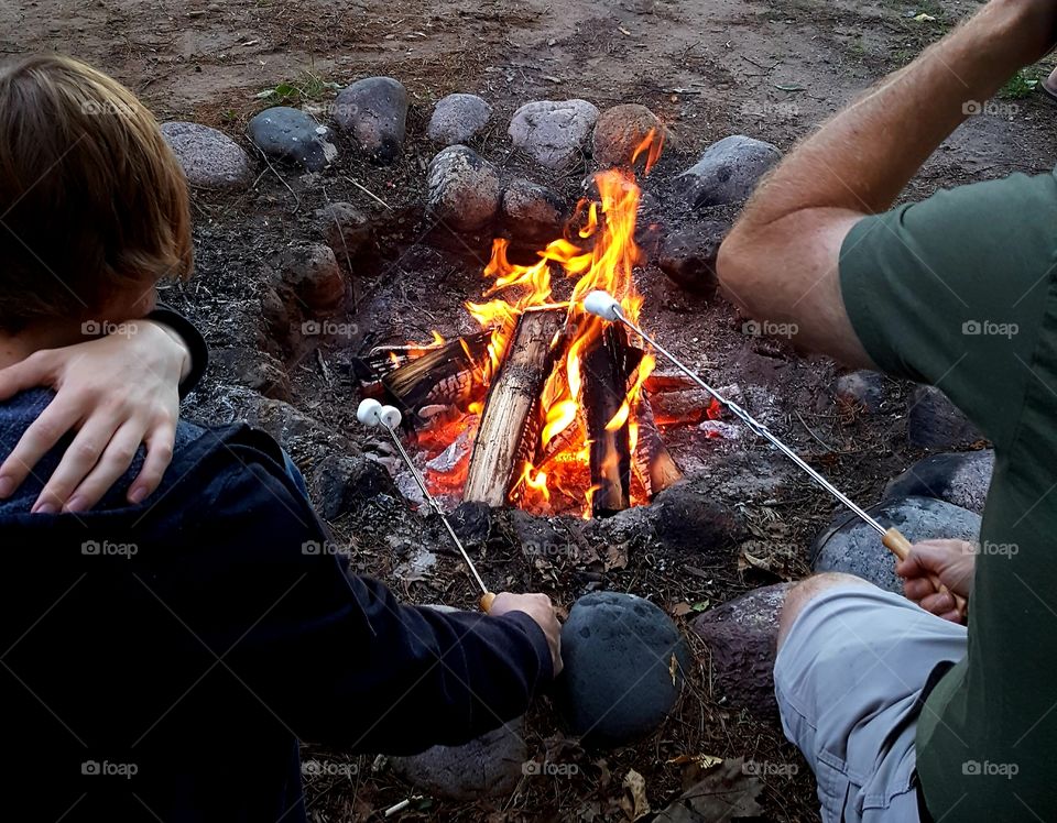camping fun while roasting marsmallows