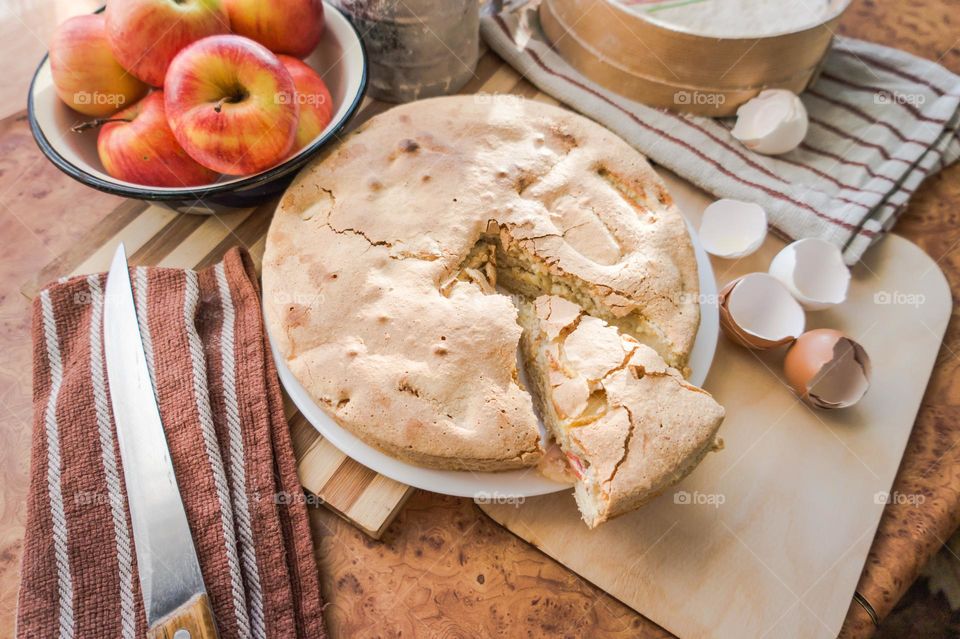 Making homemade puffed apple pie with eggs, sugar and flour.